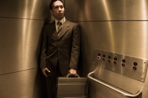 Businessman Standing Inside Elevator --- Image by © Serge Kozak/Corbis